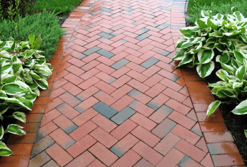 Block paving brick path designed for a landscaped garden.