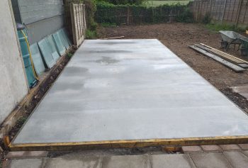Concrete shed base prepared for a shed in a garden in Southend, Essex. A solid and level foundation for long-lasting stability. Concrete Shed Bases Southend